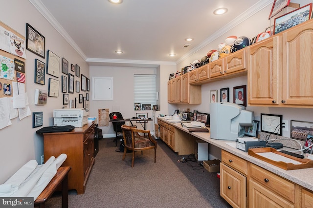 carpeted office space with built in desk and crown molding