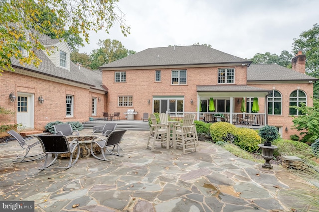 rear view of property with a patio area