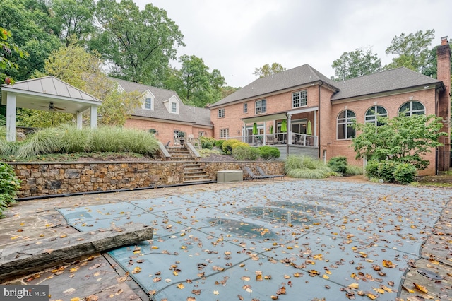 exterior space featuring a sunroom and ceiling fan