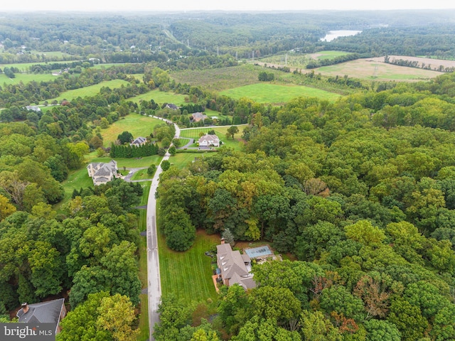 birds eye view of property with a rural view