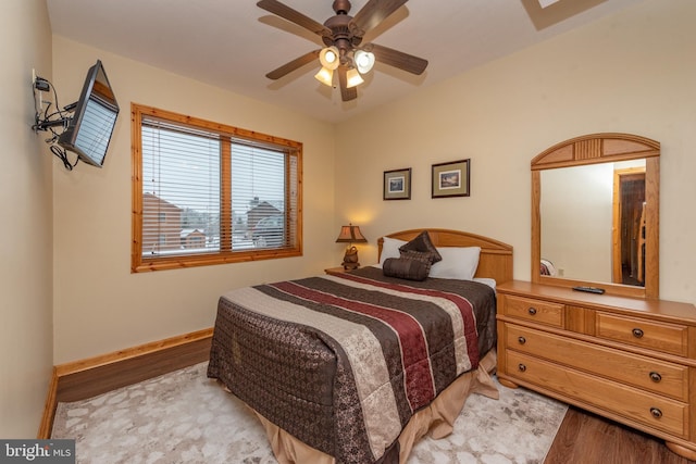 bedroom with ceiling fan and light hardwood / wood-style floors