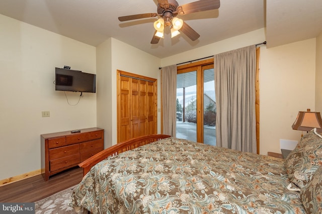 bedroom with access to outside, a closet, dark wood-type flooring, and ceiling fan