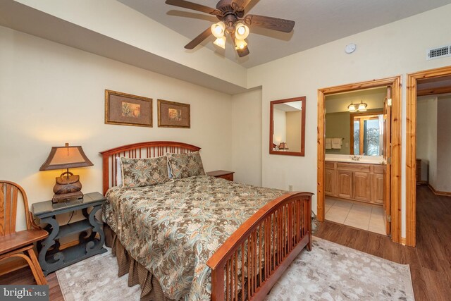 79 Cedar Shores Dr, Mc Henry, MD 21541 - bedroom with connected bathroom, visible vents, a ceiling fan, and wood finished floors