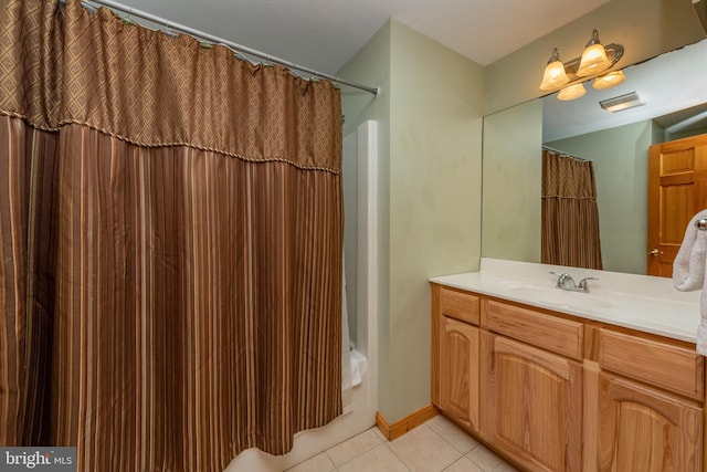 bathroom featuring shower / bath combination with curtain, tile patterned floors, and vanity