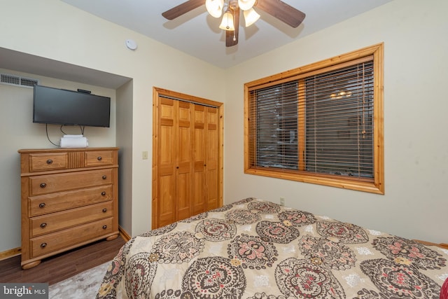 bedroom featuring ceiling fan, a closet, and hardwood / wood-style floors