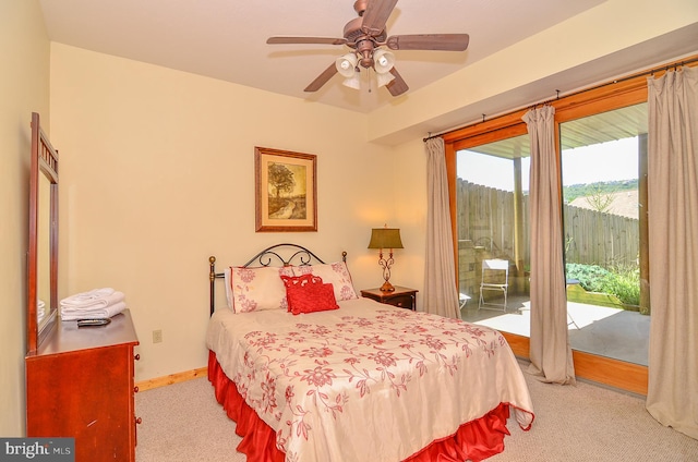 bedroom featuring ceiling fan, light colored carpet, and access to outside