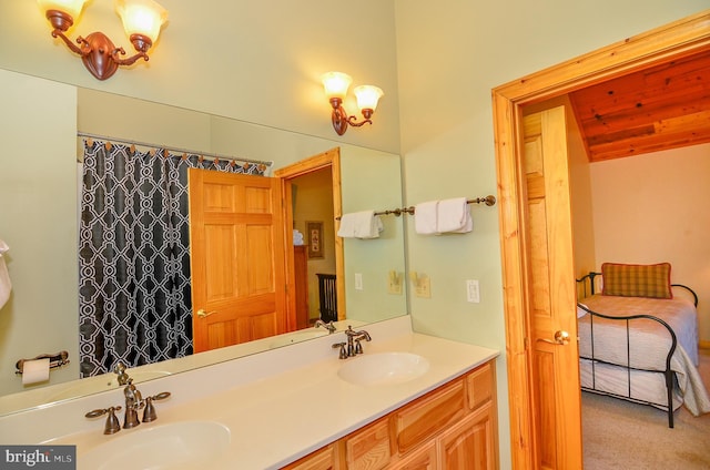 bathroom featuring a chandelier and vanity