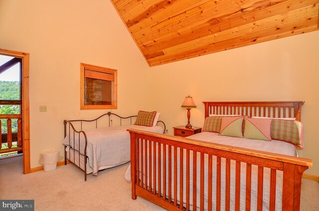 carpeted bedroom with high vaulted ceiling and wooden ceiling