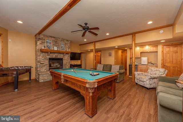 game room featuring light hardwood / wood-style flooring, billiards, ceiling fan, and a fireplace