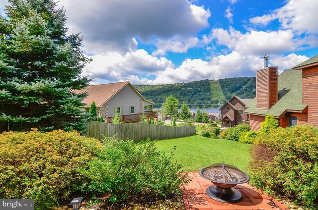 view of yard with an outdoor fire pit