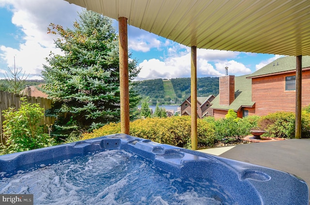 exterior space featuring a hot tub