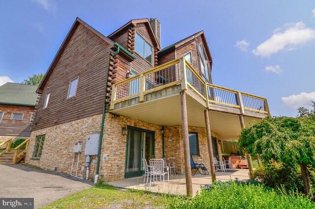 79 Cedar Shores Dr, Mc Henry, MD 21541 - rear view of property featuring stone siding, a patio area, a chimney, log exterior, and a balcony