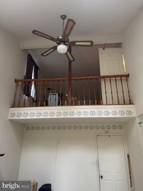 stairway with ceiling fan