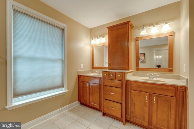 bathroom with tile patterned floors and vanity