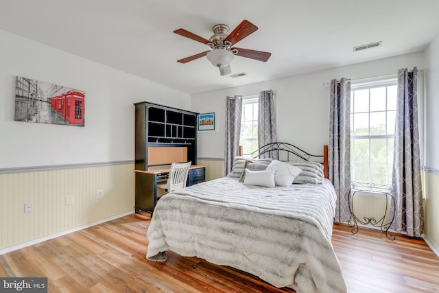 bedroom featuring wood-type flooring and ceiling fan