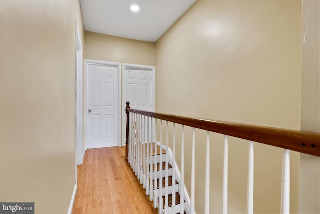 hallway with light hardwood / wood-style flooring