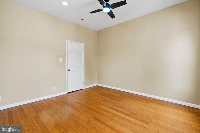 empty room featuring wood-type flooring and ceiling fan