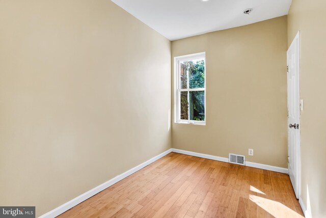 spare room featuring light wood-type flooring