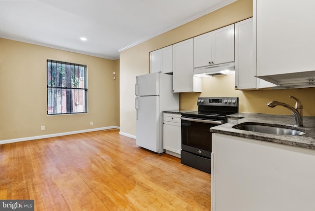 kitchen with light hardwood / wood-style floors, white refrigerator, electric range, sink, and white cabinets