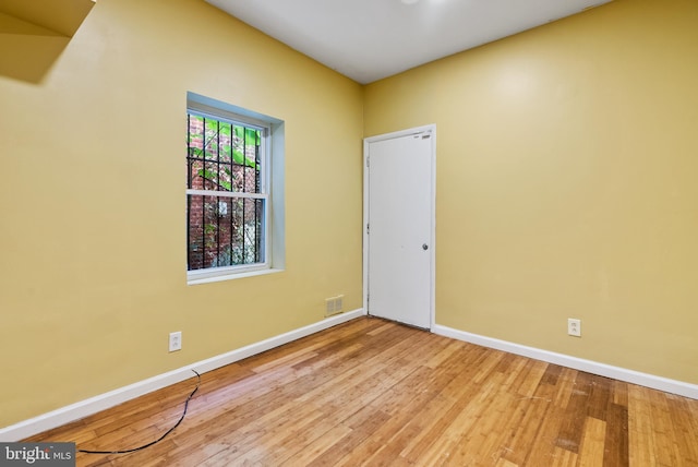 empty room with light hardwood / wood-style floors