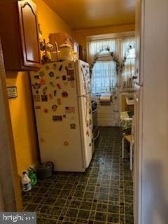 kitchen featuring white fridge