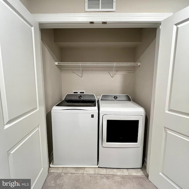 laundry room with washer and clothes dryer