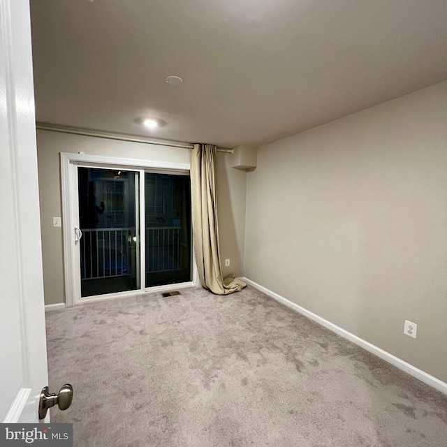 empty room with carpet flooring