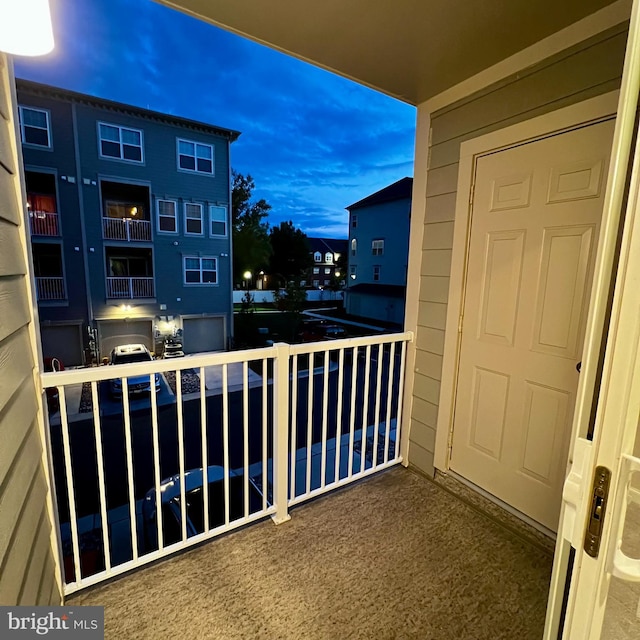 view of balcony at dusk