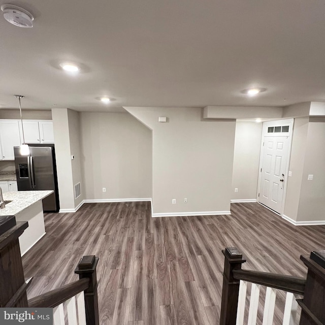 unfurnished living room featuring dark hardwood / wood-style floors