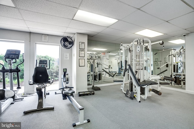 exercise room with a drop ceiling