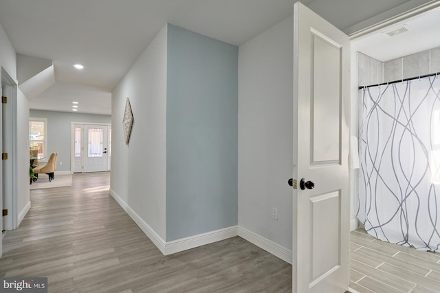 interior space featuring french doors and light wood-type flooring