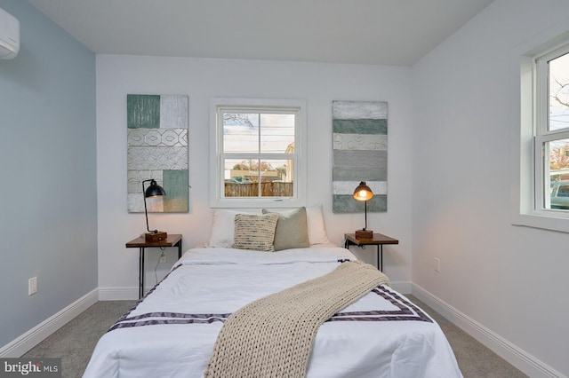 carpeted bedroom featuring a wall unit AC