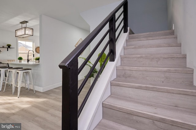 staircase with wood-type flooring