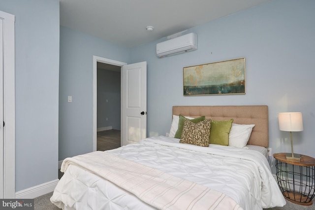 bedroom with carpet floors and an AC wall unit