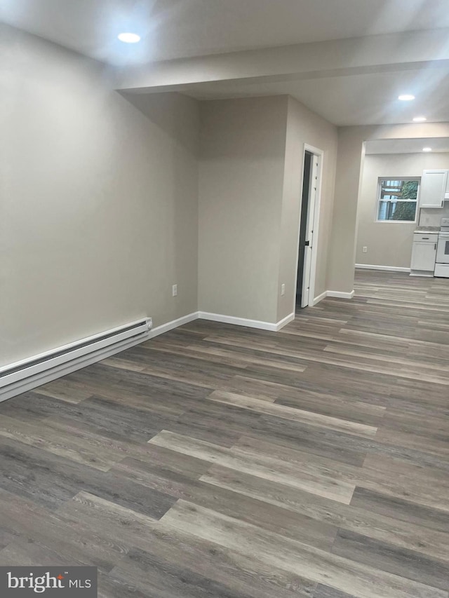 basement with dark hardwood / wood-style flooring