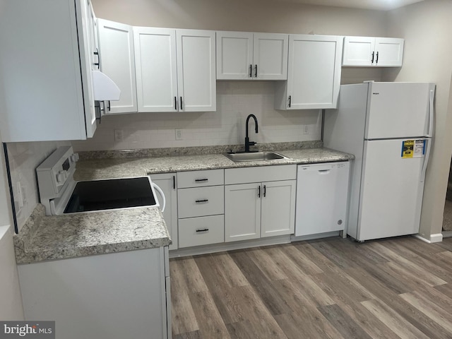 kitchen with backsplash, sink, white cabinets, white appliances, and dark hardwood / wood-style flooring