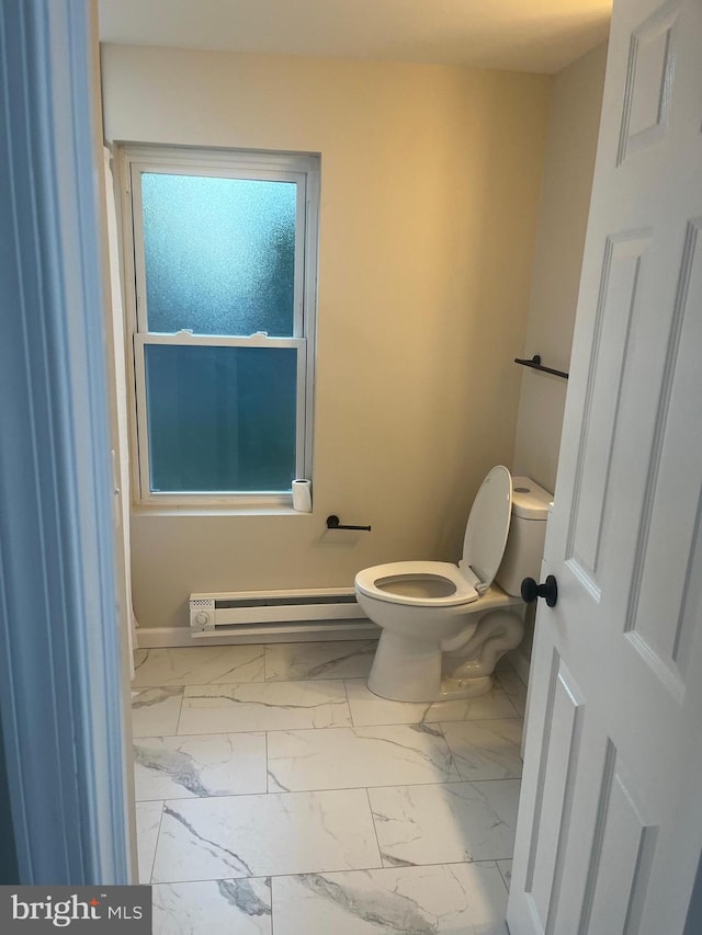 bathroom with toilet and a baseboard radiator