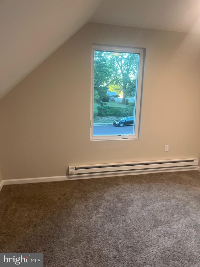 bonus room with lofted ceiling, a baseboard heating unit, and carpet