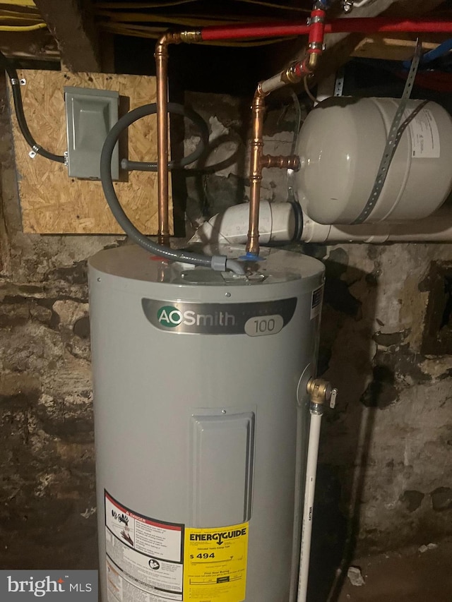 utility room featuring water heater