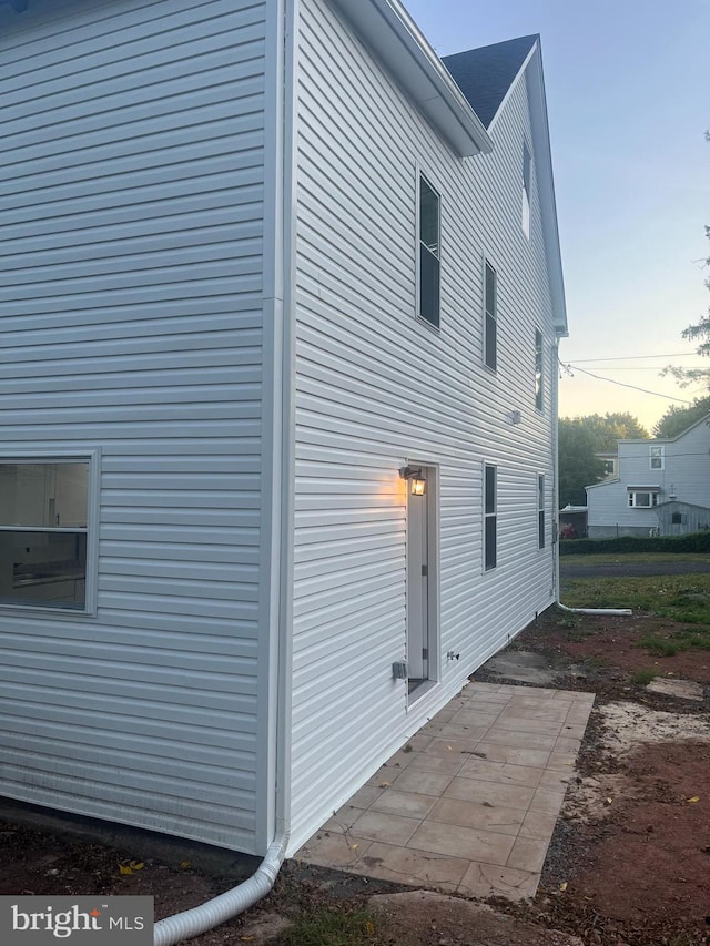 view of property exterior at dusk