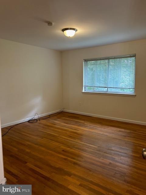 empty room featuring hardwood / wood-style floors