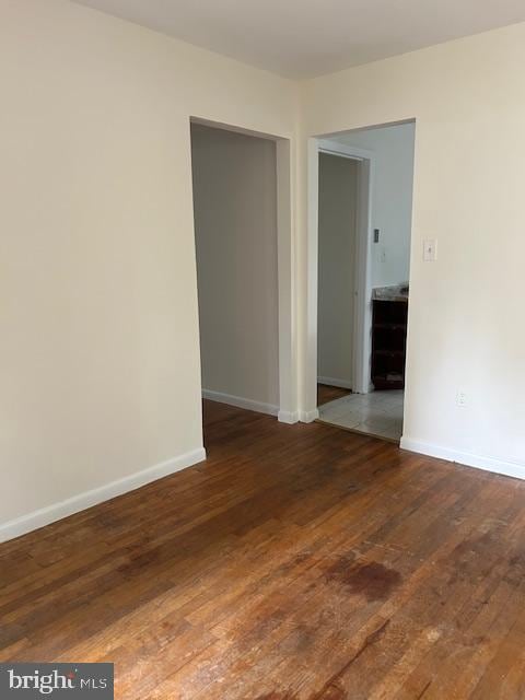 empty room featuring dark hardwood / wood-style floors