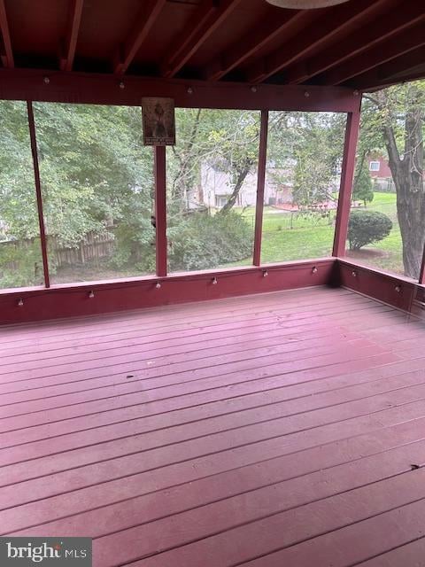 unfurnished sunroom with a wealth of natural light