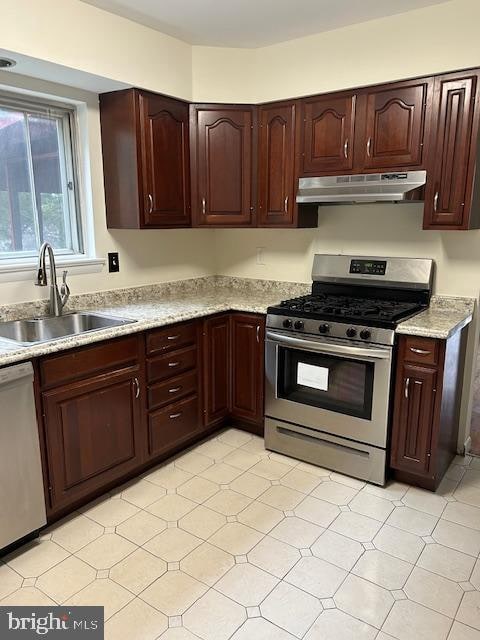 kitchen with appliances with stainless steel finishes and sink