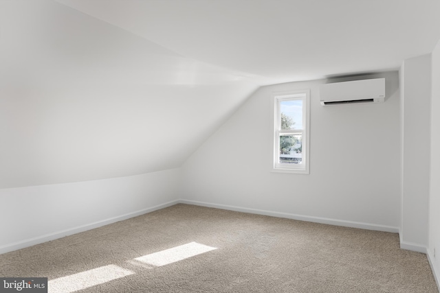 bonus room featuring vaulted ceiling, carpet flooring, and a wall mounted air conditioner