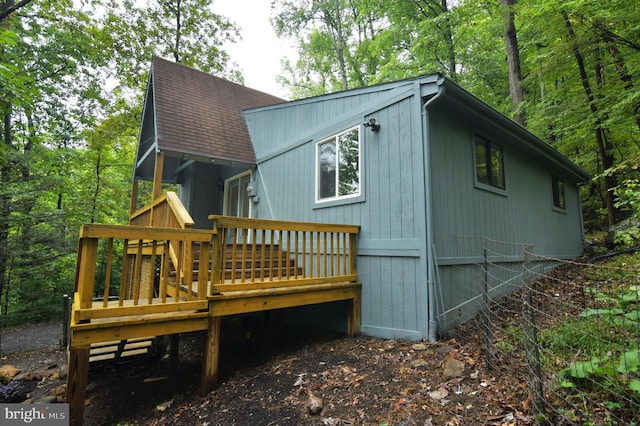 back of house featuring a wooden deck