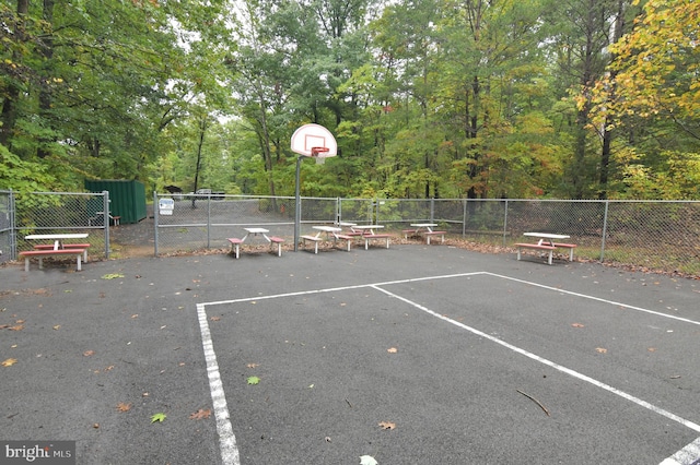 view of parking featuring basketball court