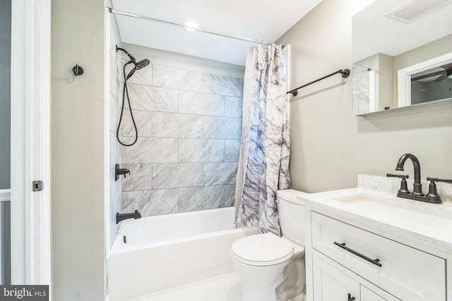 full bathroom with vanity, toilet, and shower / bath combo