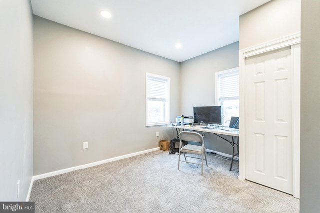 office area featuring light colored carpet and a wealth of natural light