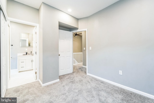 unfurnished bedroom featuring light colored carpet